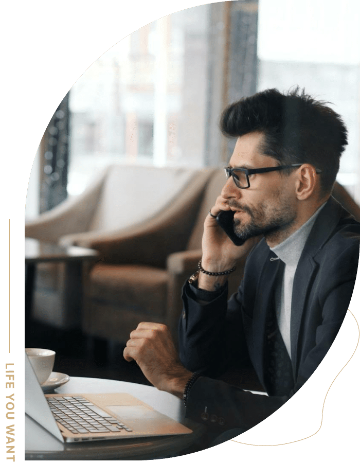 Professional man on phone reflecting the support found through online anxiety counseling.